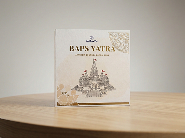BAPS Yatra board game box featuring colorful artwork of BAPS mandirs and dharmic symbols