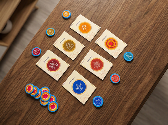 Game cards spread on table showing Maya and Sadbuddhi cards