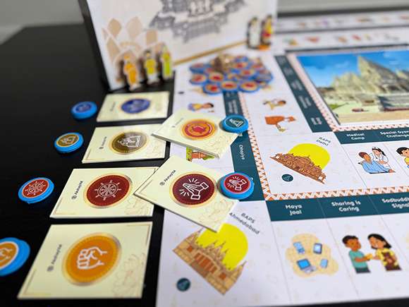 Complete BAPS Yatra game set with board, cards, tokens, and dice